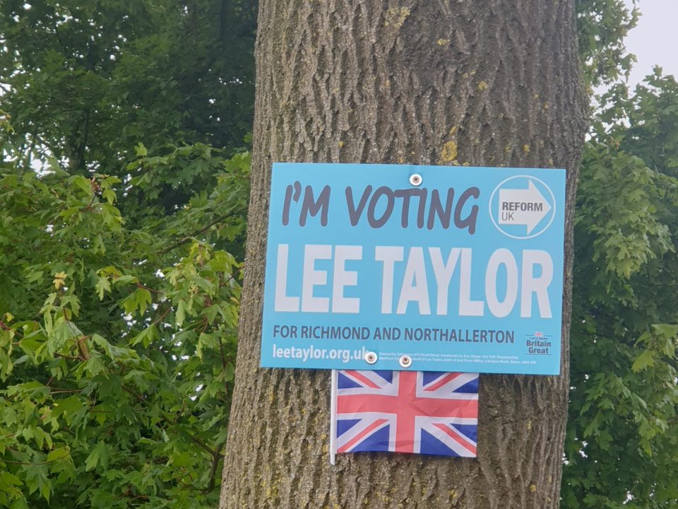 Reform UK sign on tree
